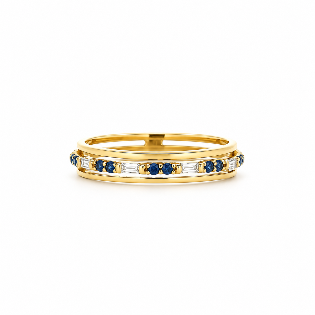 A yellow gold eternity ring featuring a channel-set row of round-cut blue sapphires and baguette-cut clear stones, shown on a clean white background.