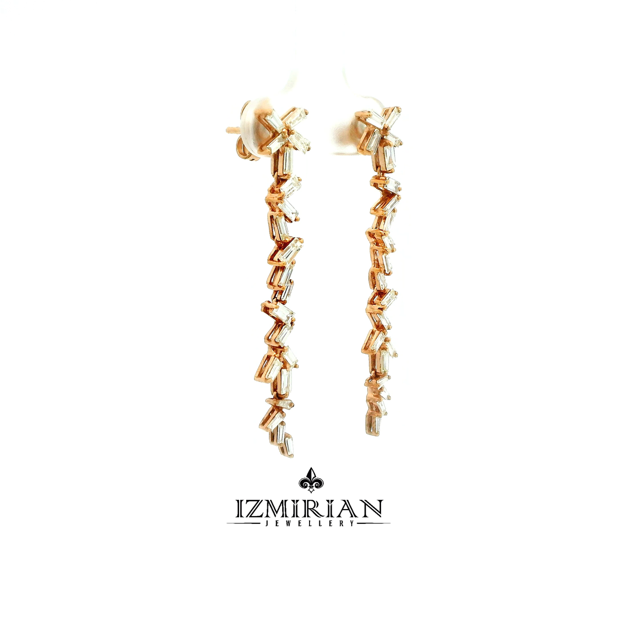 Side view of rose gold earrings with baguette diamond line drops