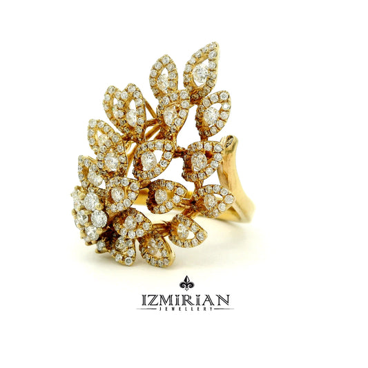 Angled view of layered diamond leaf ring in yellow gold