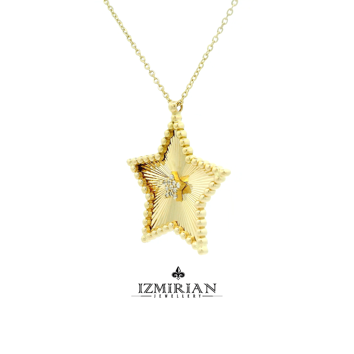 Angled view of diamond star pendant necklace in yellow gold