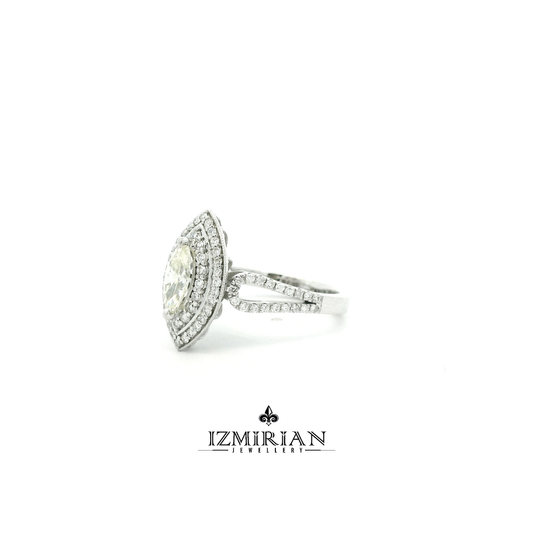 Angled view of marquise diamond ring with layered halo design