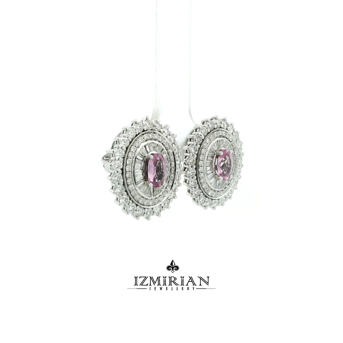 Side view of white gold earrings with pink sapphire and diamond halo