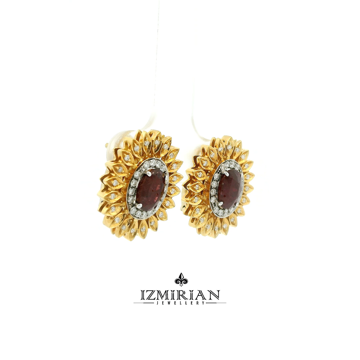 Side view of yellow gold ring with ruby center and diamond detailing
