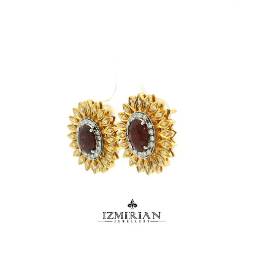 Angled view of yellow gold ruby ring with diamond halo and petal design