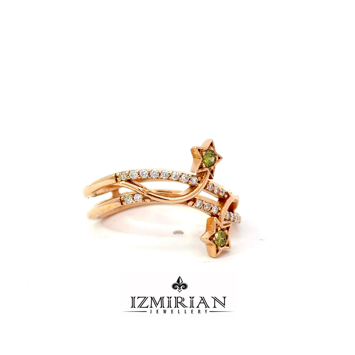 Side view of rose gold diamond ring with star-shaped green gemstone