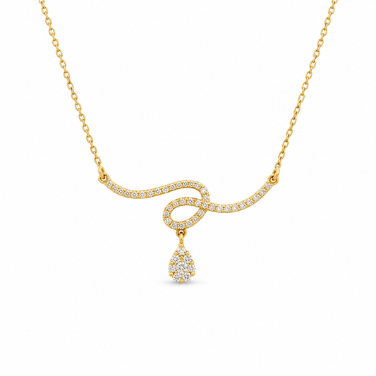 A gold necklace with a wavy chain design paved with small clear stones, featuring a teardrop-shaped pendant also set with clear stones, shown on a plain white background.