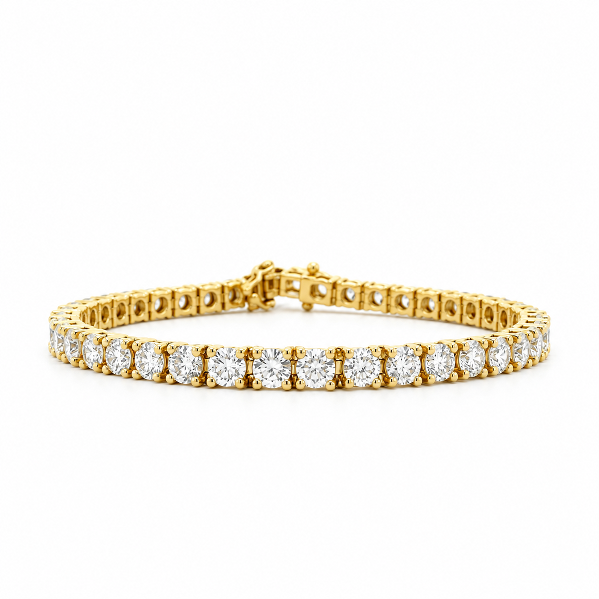 A yellow gold tennis bracelet featuring a continuous row of round-cut clear gemstones in a prong setting, displayed on a clean white background.