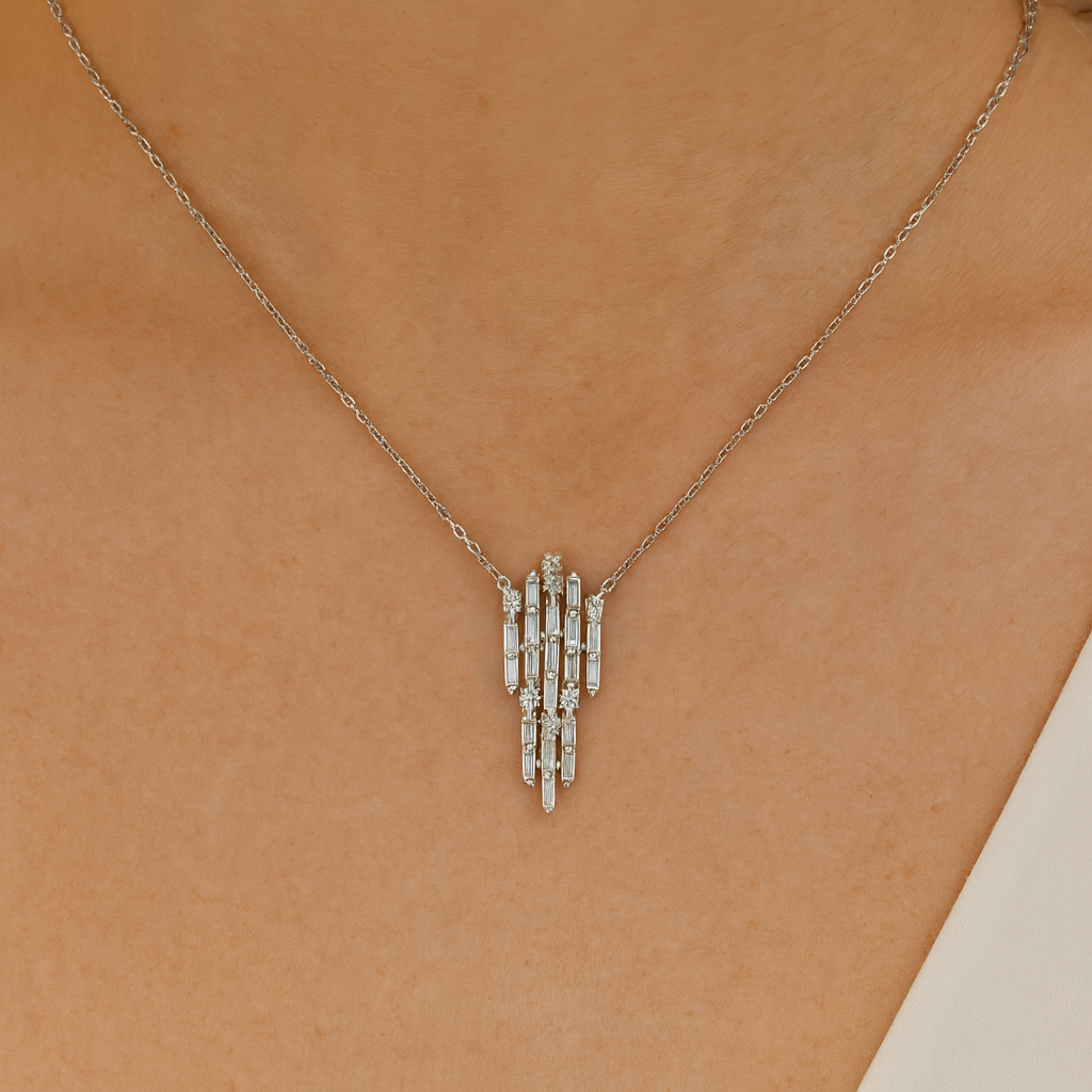 Side view of white gold pendant with baguette diamond cascade