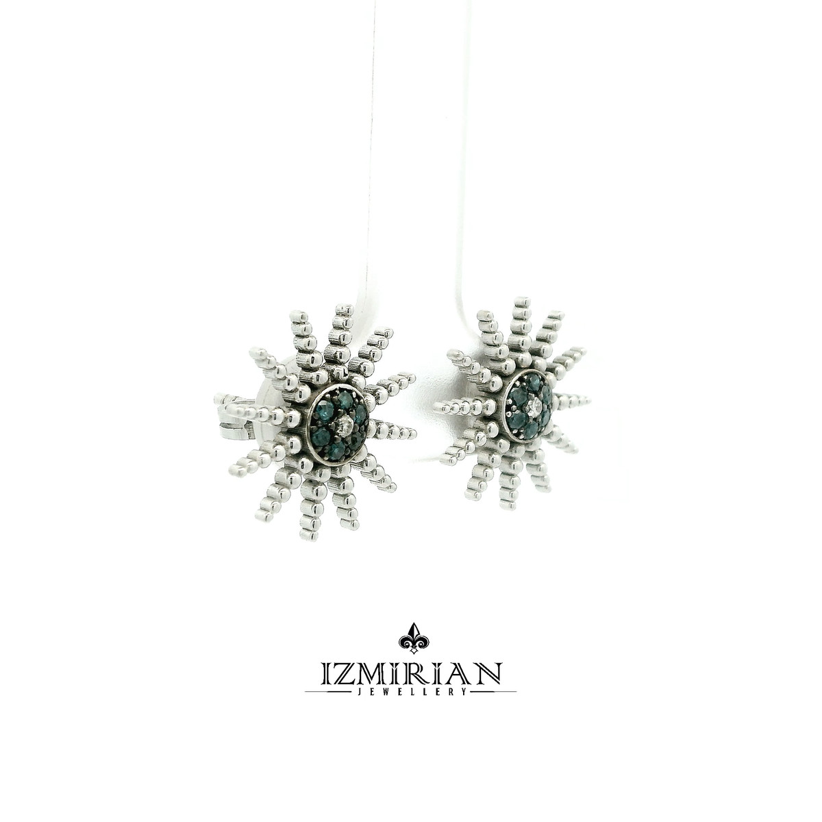 Side view of white gold sunburst stud with blue diamonds and beaded rays