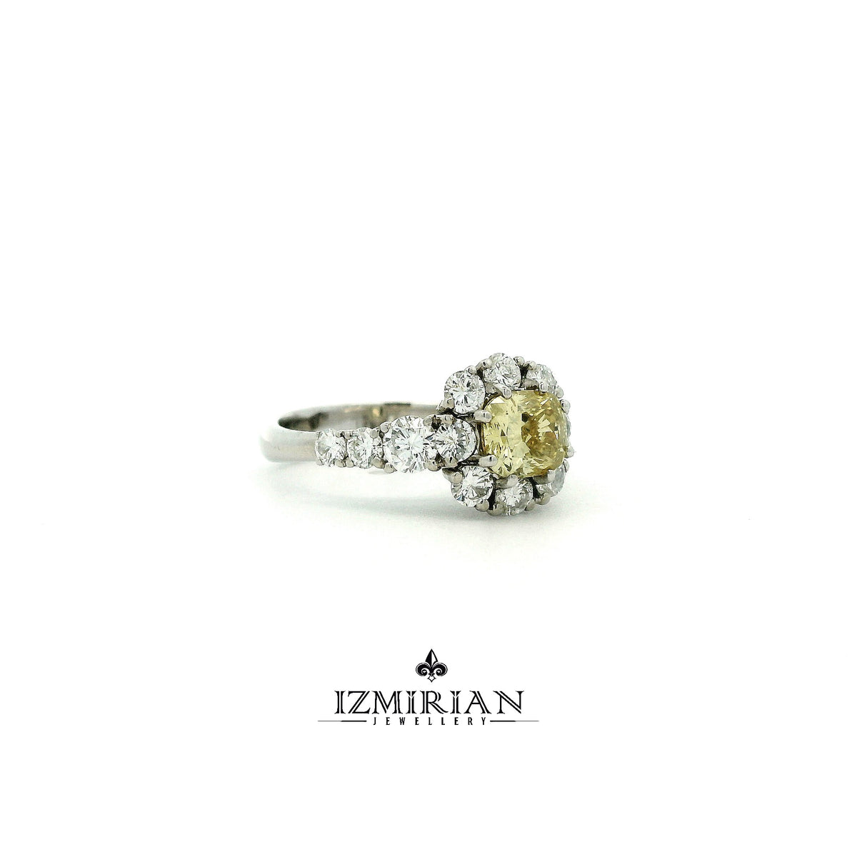Side view of white gold ring with brown diamond center and white diamond accents
