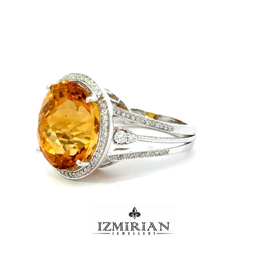 Angled view of oval citrine open cuff ring with pavé diamonds