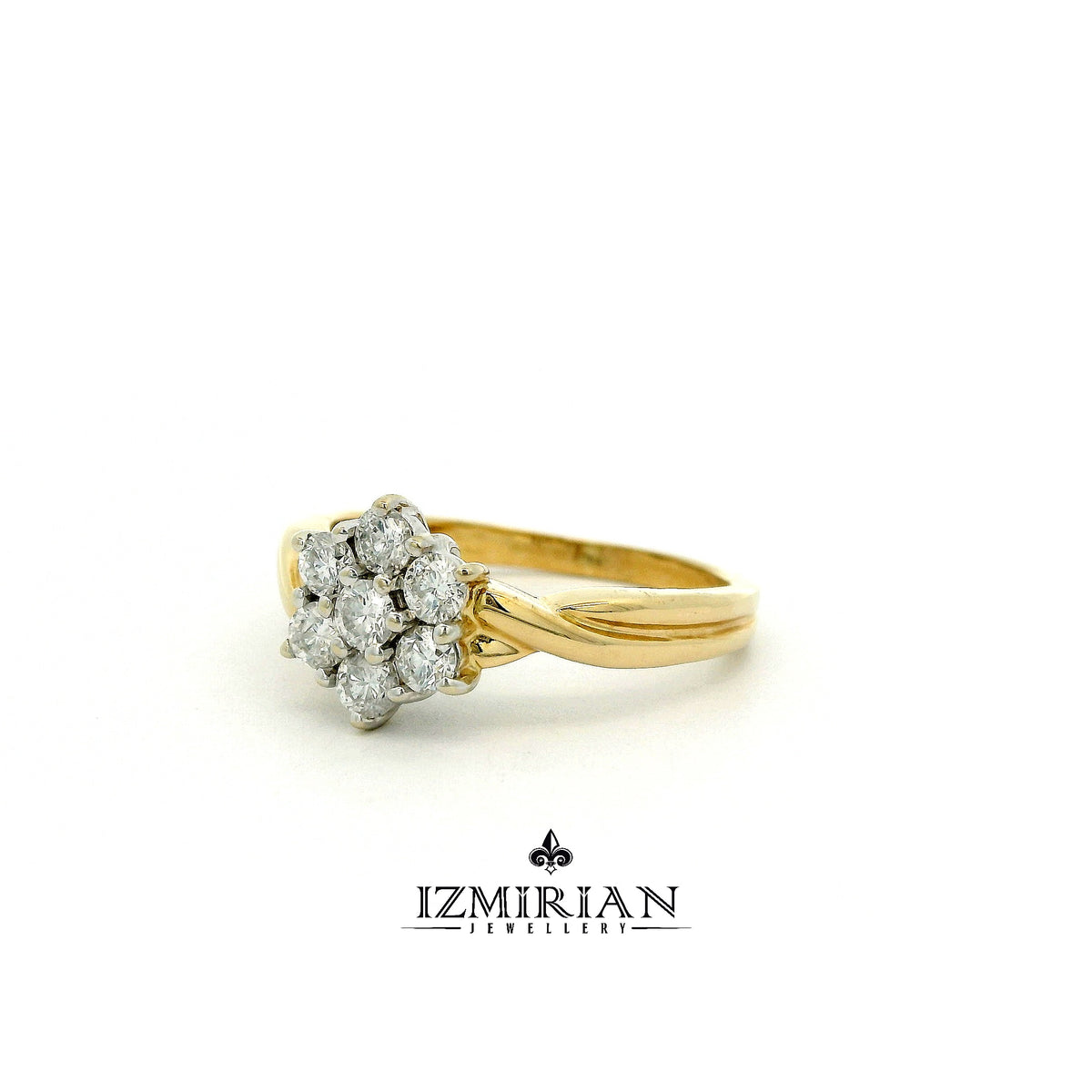 Angled side view of diamond cluster ring in yellow gold