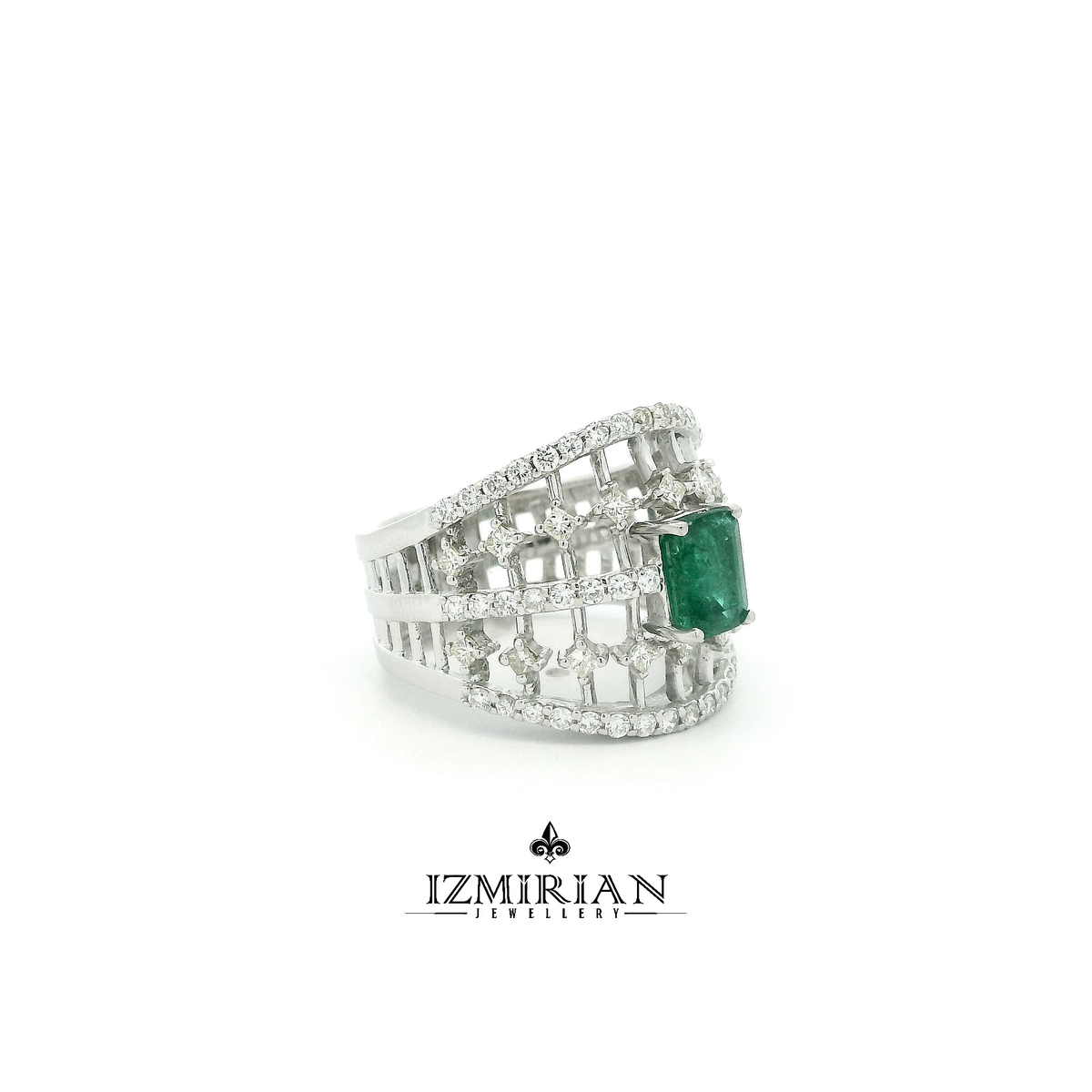 Side view of white gold emerald ring with diamond openwork band