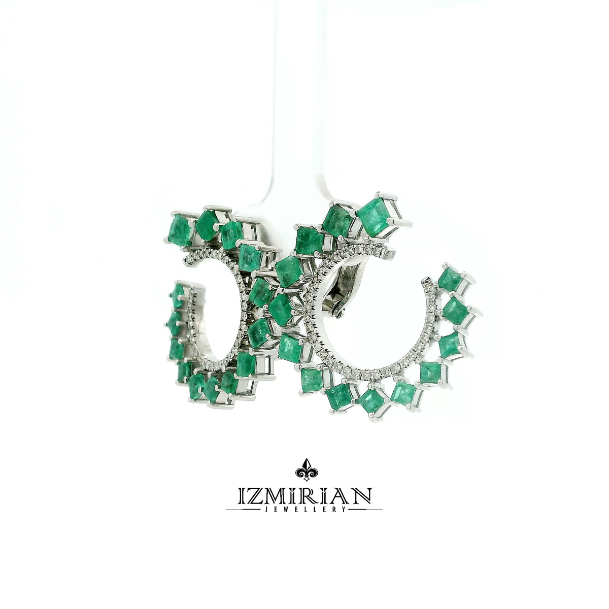 Angled view of square emerald crown hoop earrings