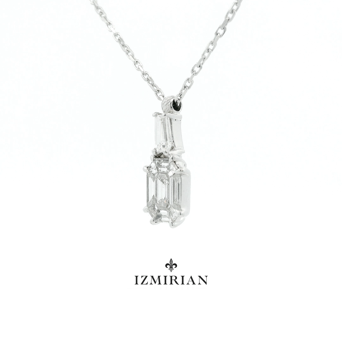 Angled view of emerald-cut diamond pendant in white gold