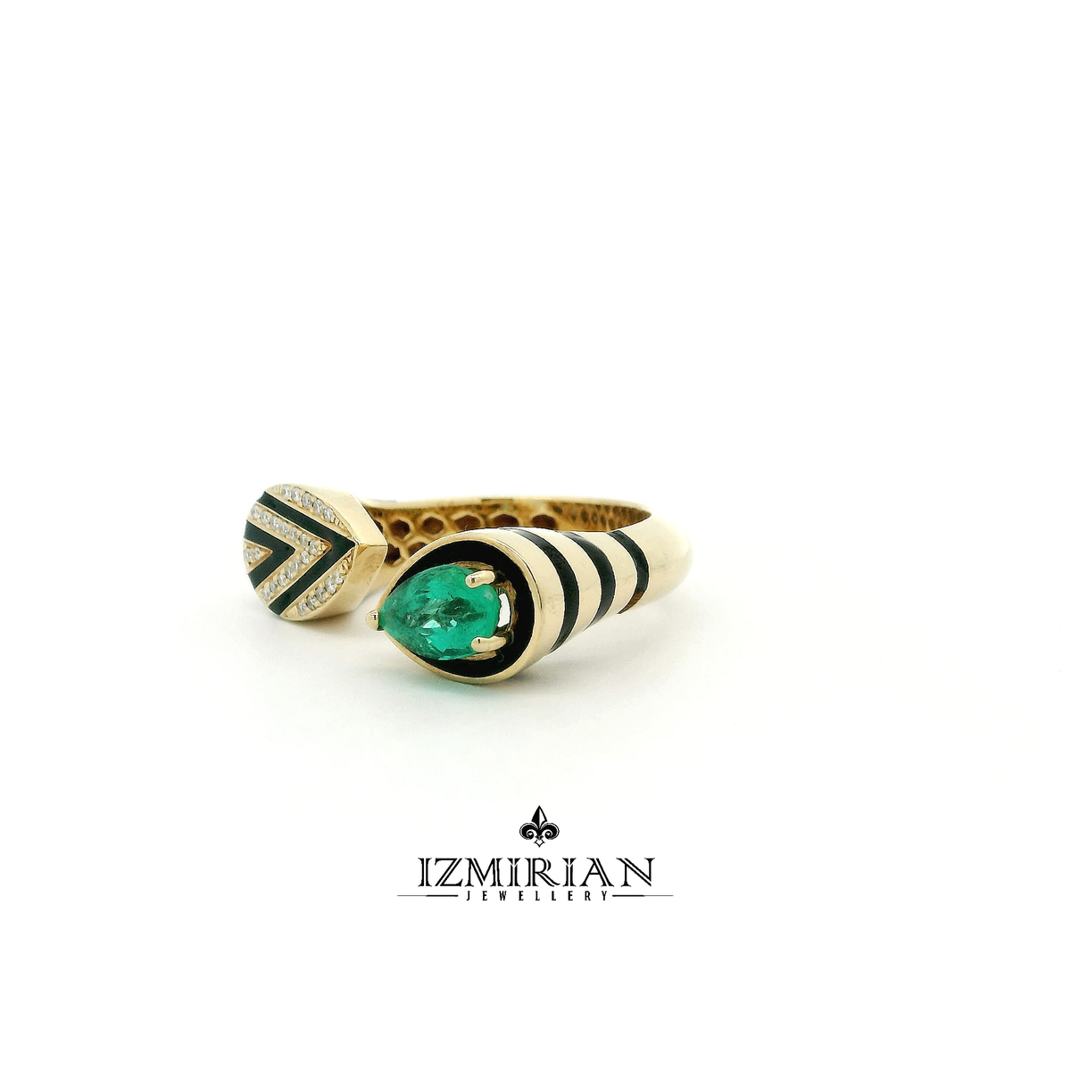 Angled view of emerald and diamond open cuff ring in yellow gold