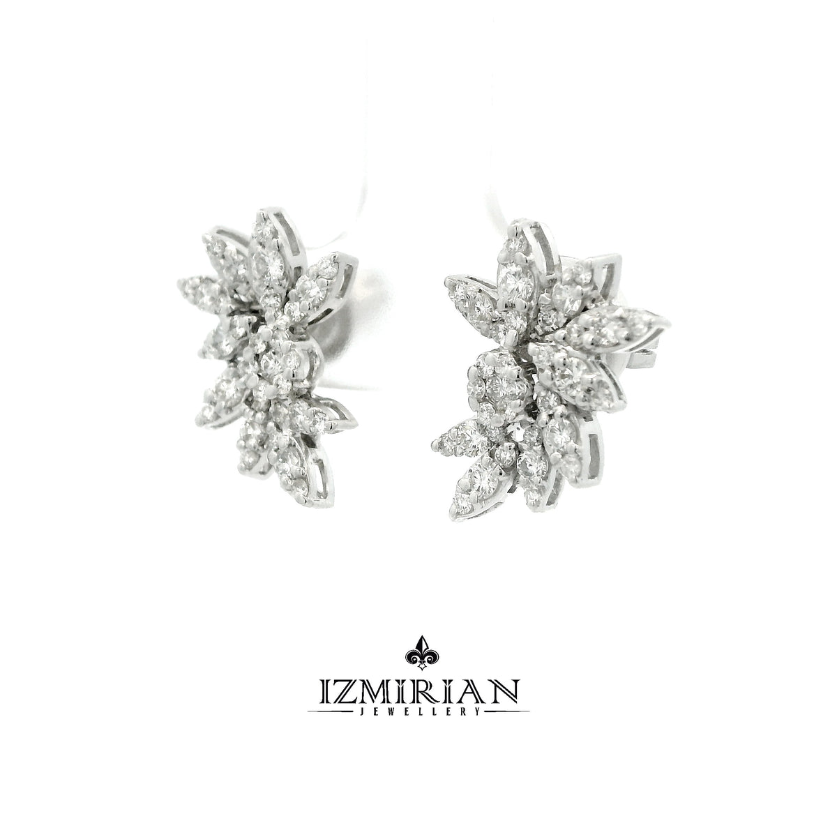 Angled view of marquise diamond flower earrings in white gold