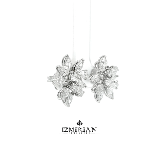 Side view of white gold diamond flower stud earrings
