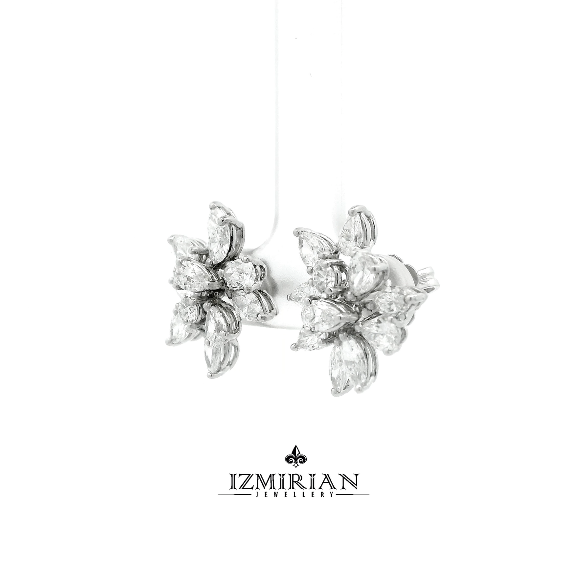 Angled view of marquise diamond flower earrings in white gold