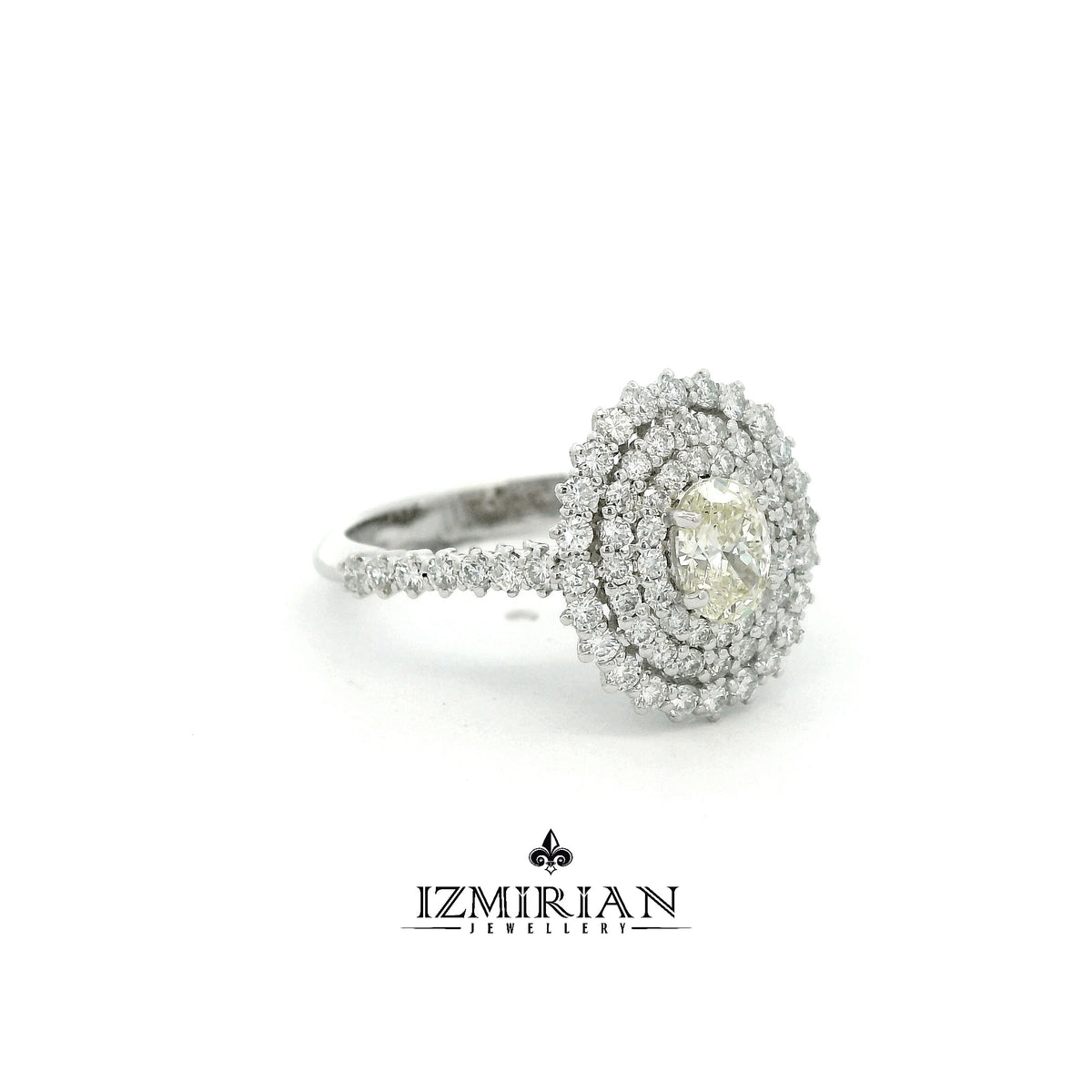 Side view of white gold ring with oval diamond and layered halos
