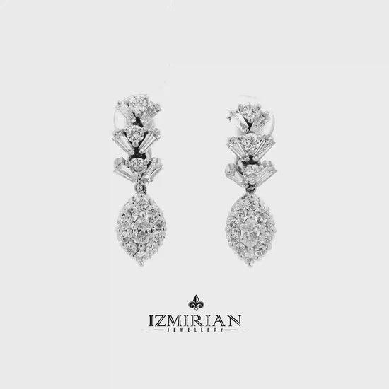 Diamond drop cluster earrings in white gold shown in motion
