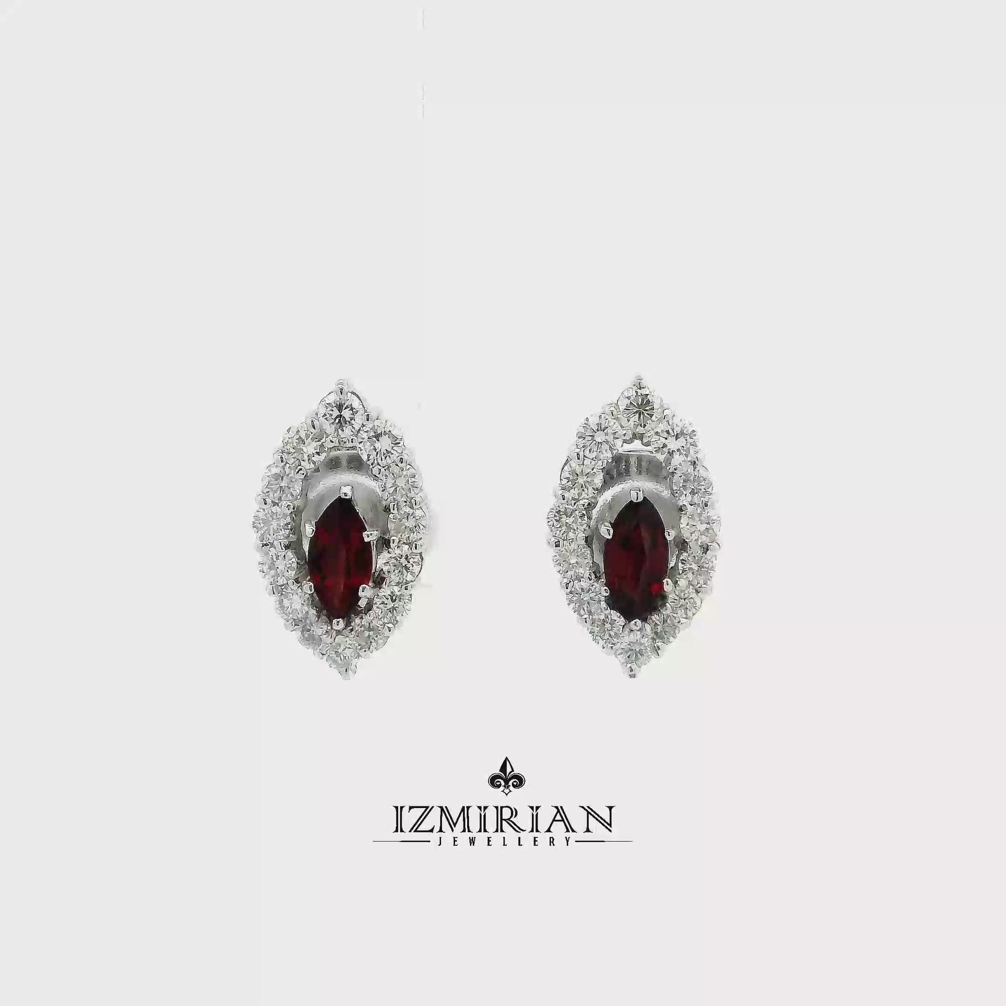 Garnet halo stud earrings in white gold shown in motion