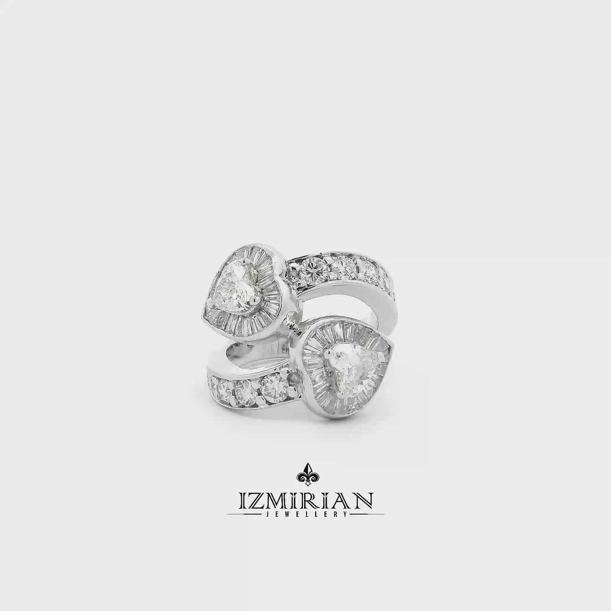 Double heart diamond wrap ring in white gold shown in motion