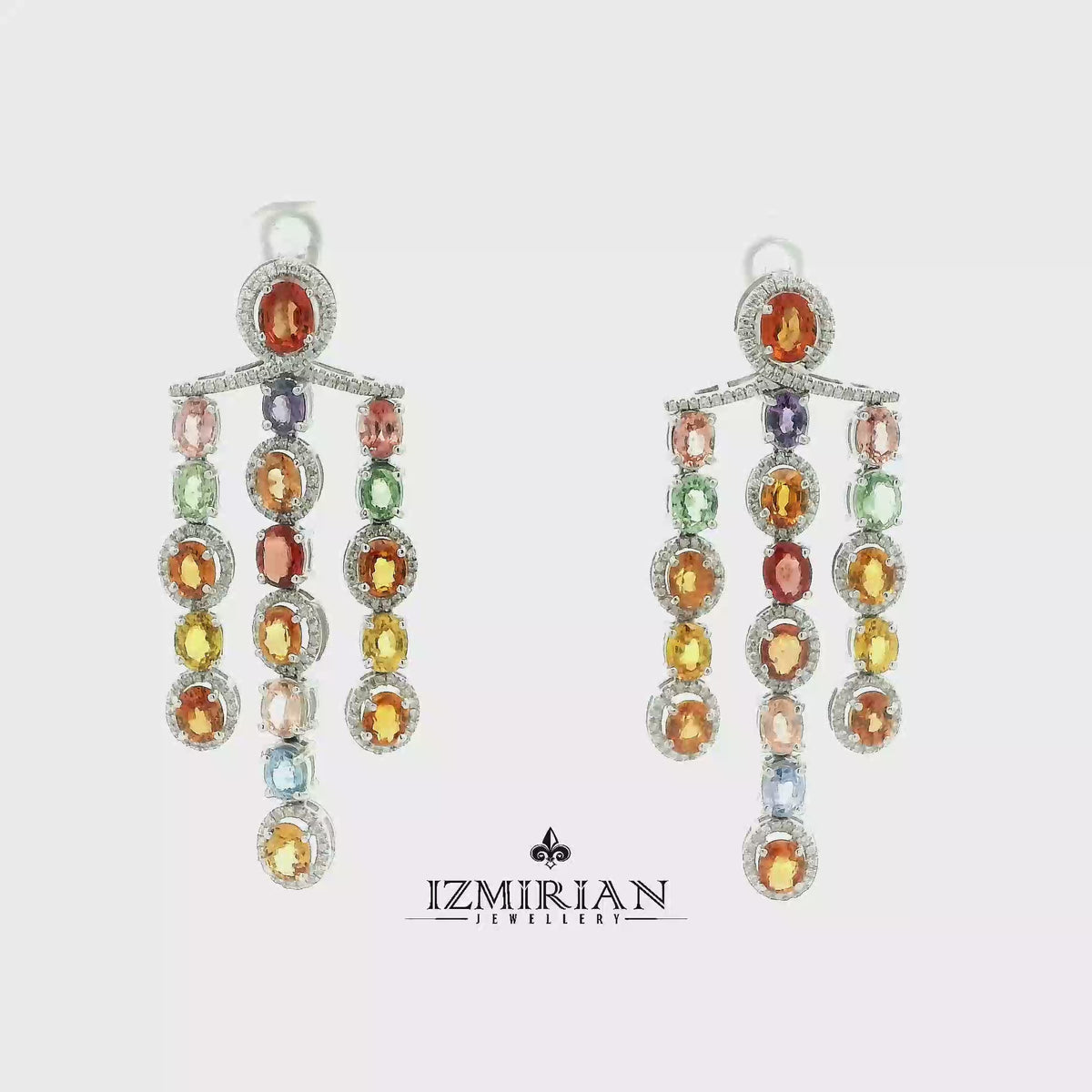 Multicolor sapphire and diamond drop pendant in white gold shown in motion