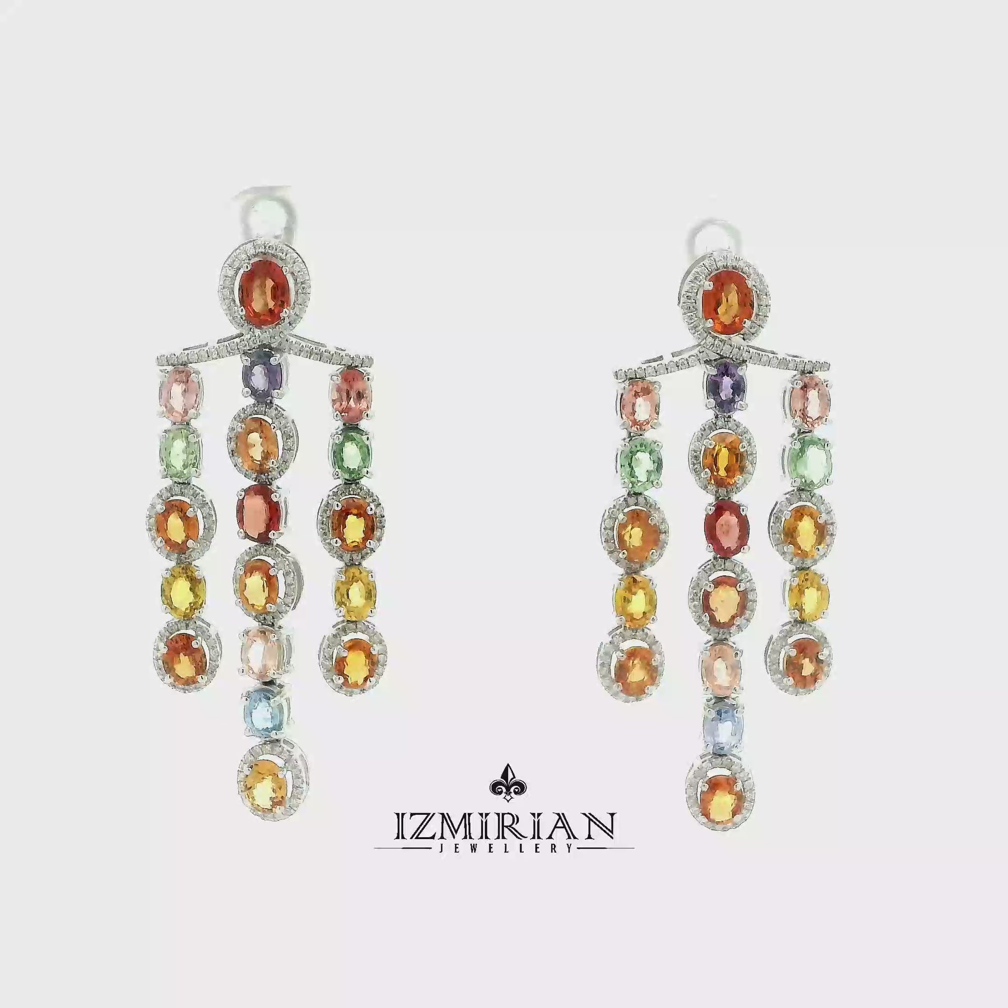 Multicolor sapphire and diamond drop pendant in white gold shown in motion