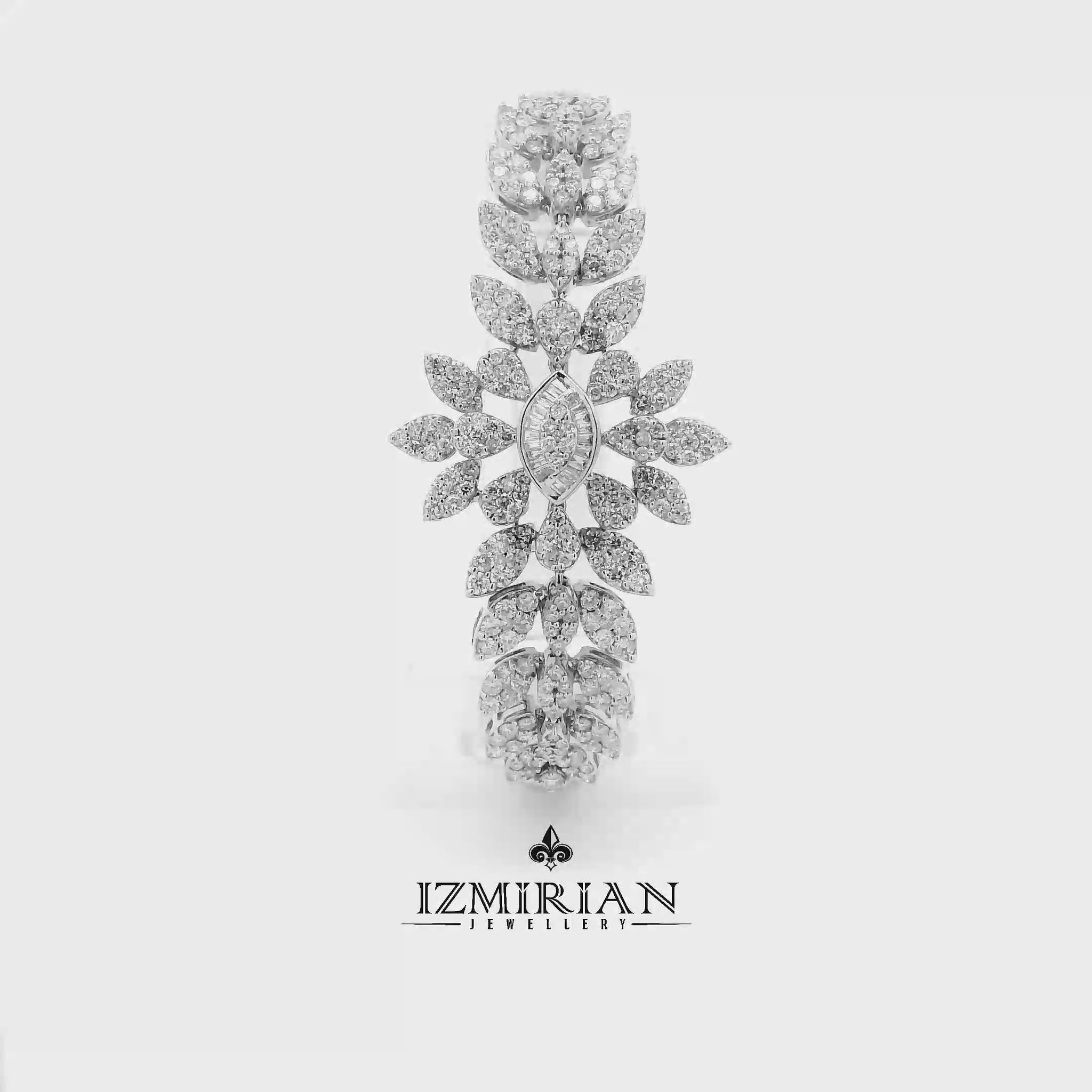 Diamond floral cascade drop earring in white gold shown in motion