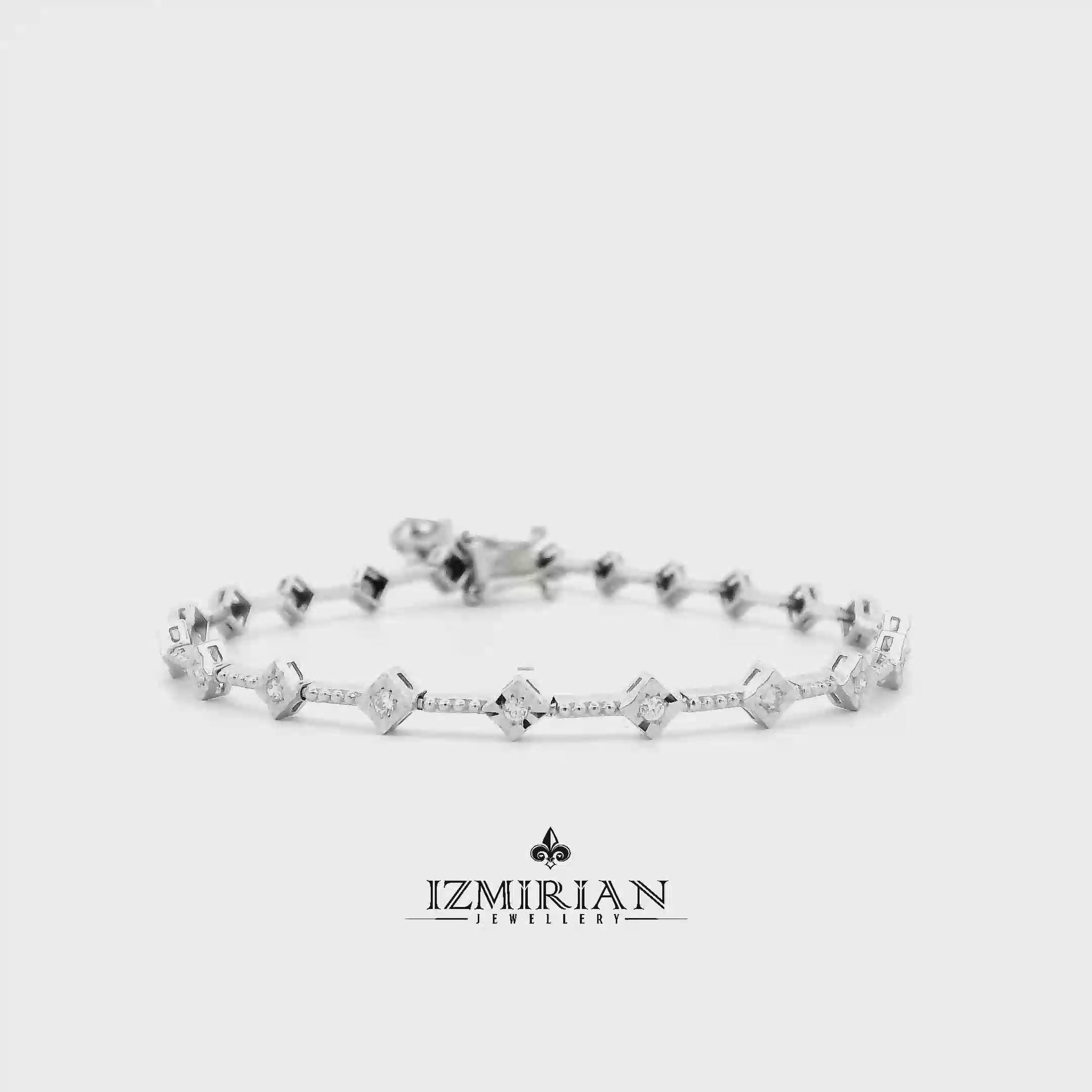 Diamond station bracelet in white gold shown in motion