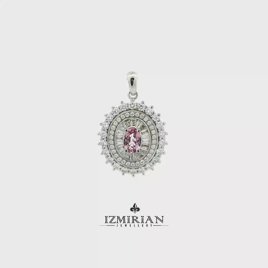 Pink sapphire and diamond halo pendant in white gold shown in motion