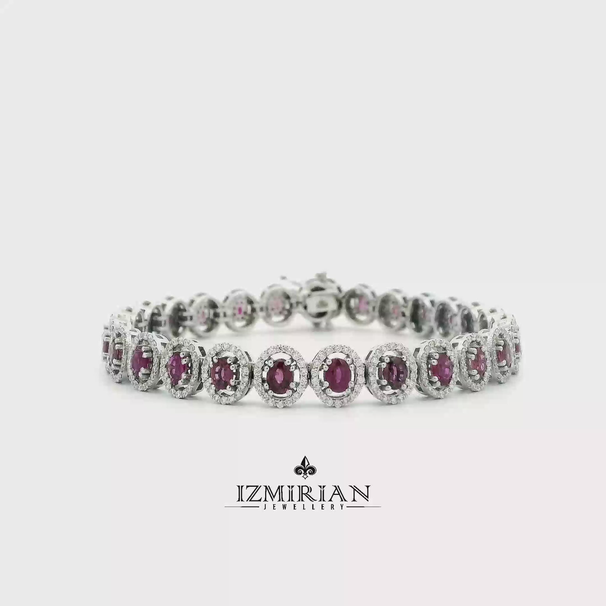 Ruby and diamond halo tennis bracelet in white gold shown in motion