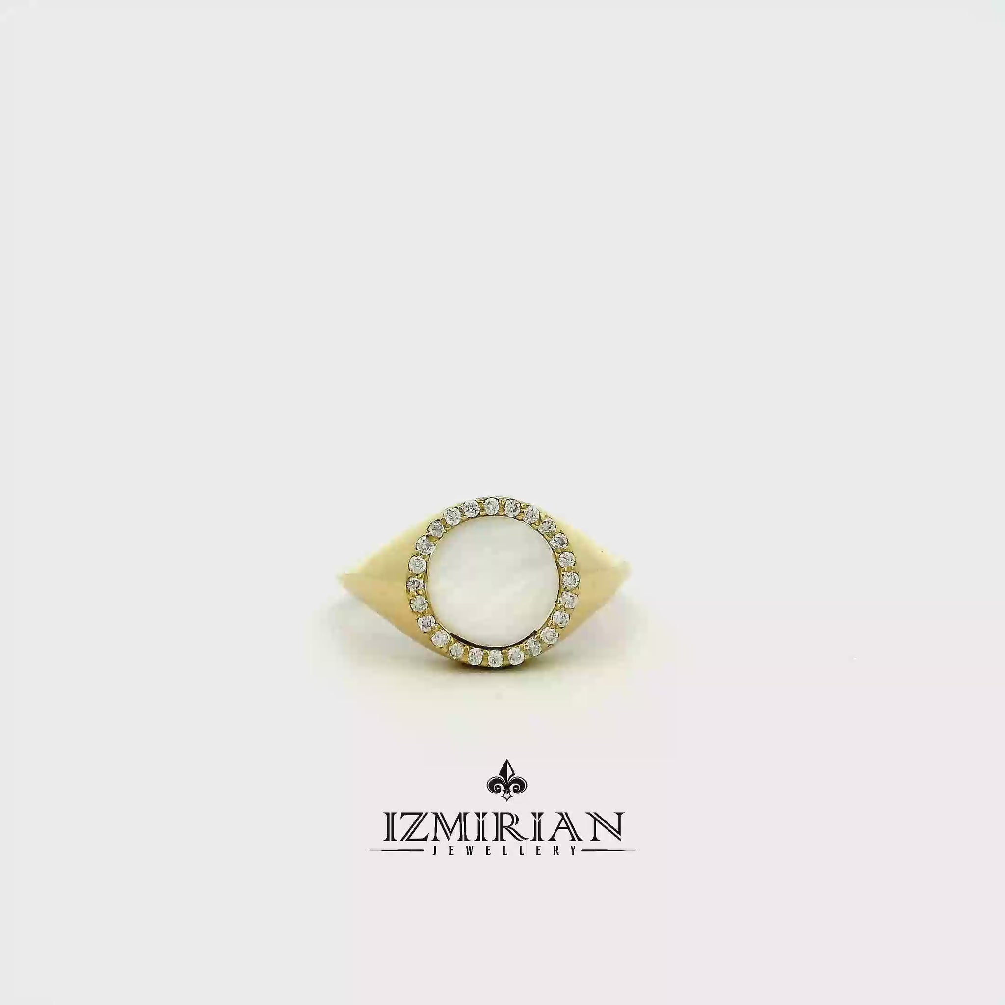 Mother of pearl halo ring in yellow gold shown in motion
