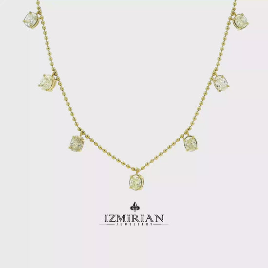 Diamond drop station necklace in yellow gold shown in motion