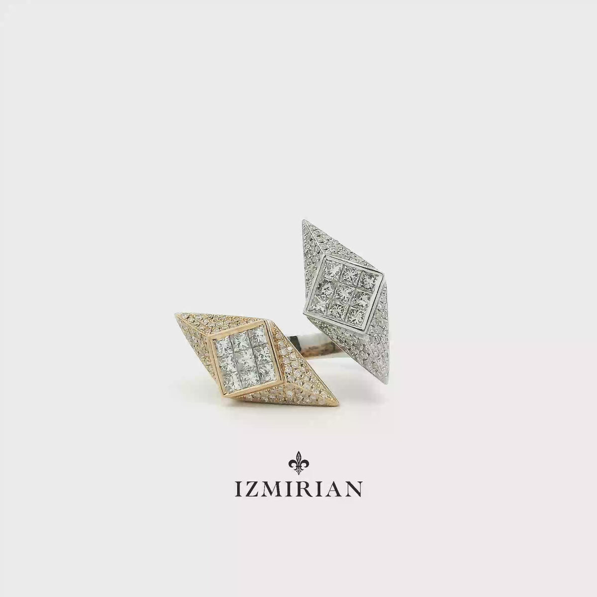Geometric two-tone diamond open ring shown in motion