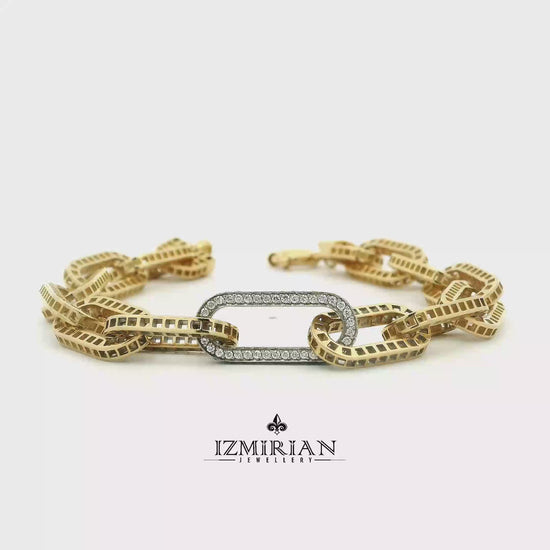 Diamond link chain bracelet in yellow and white gold shown in motion