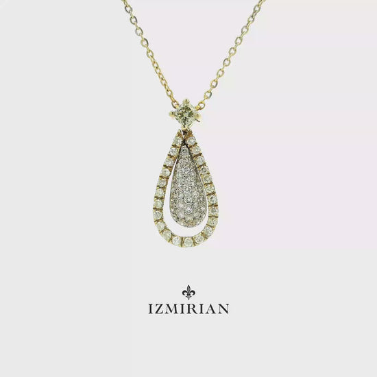 Diamond teardrop pendant necklace in yellow gold shown in motion