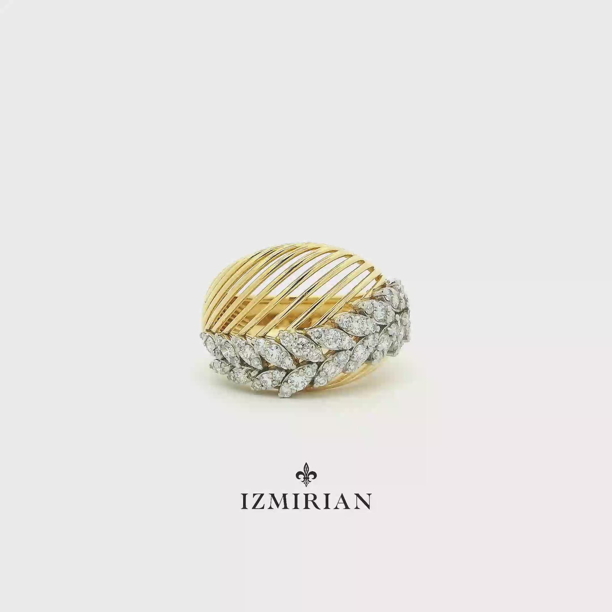 Marquise diamond wave ring in yellow gold shown in motion