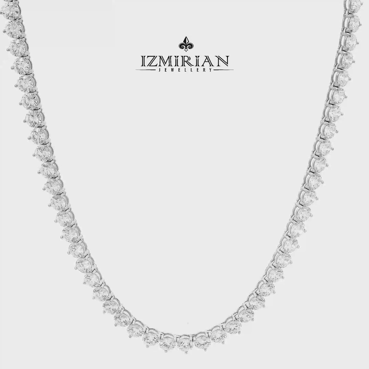 Classic diamond tennis necklace in white gold shown in motion