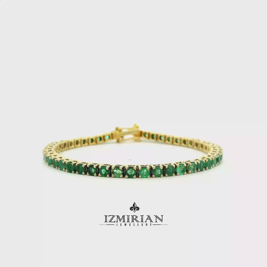 
Emerald tennis bracelet in yellow gold shown in motion