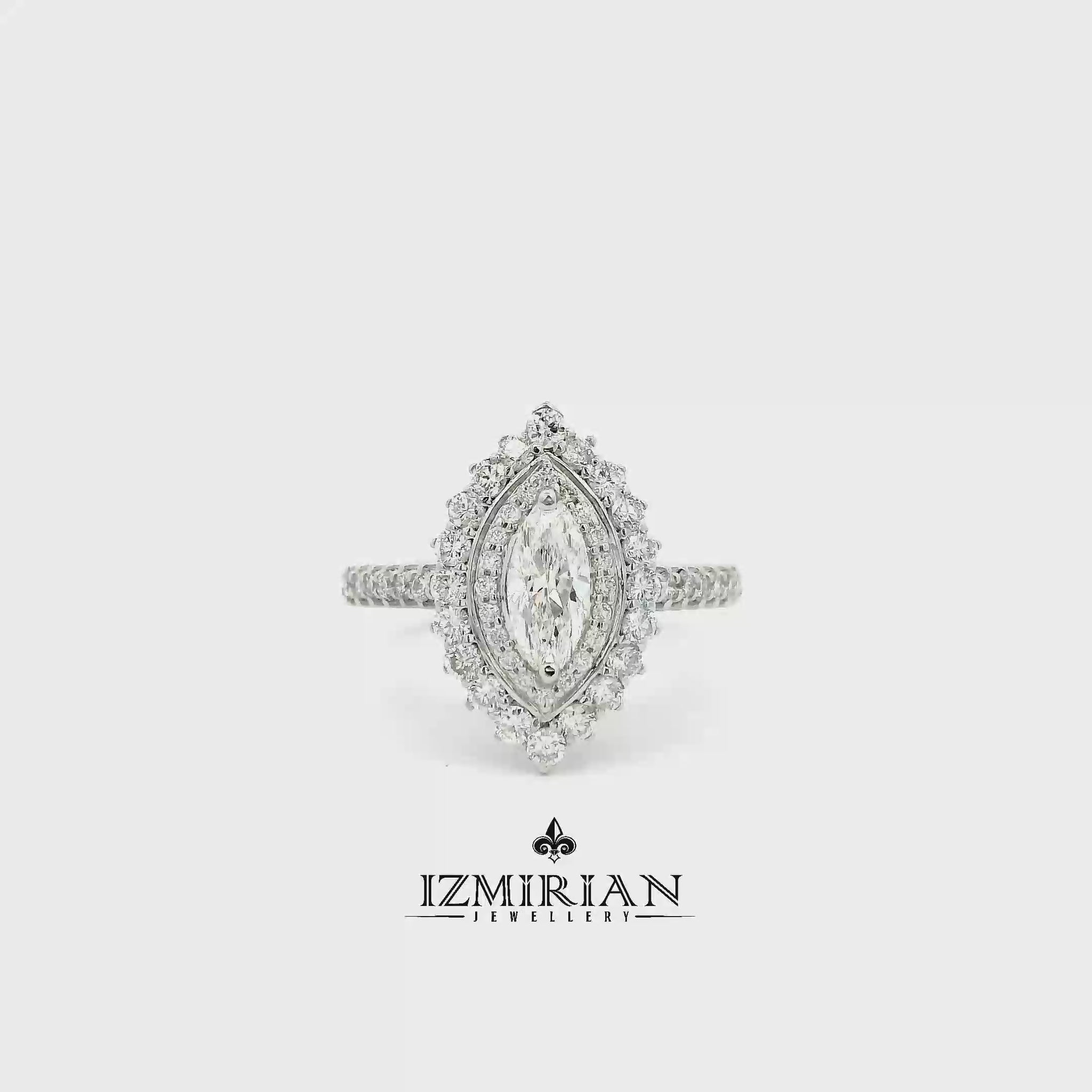 Marquise diamond halo ring in white gold shown in motion