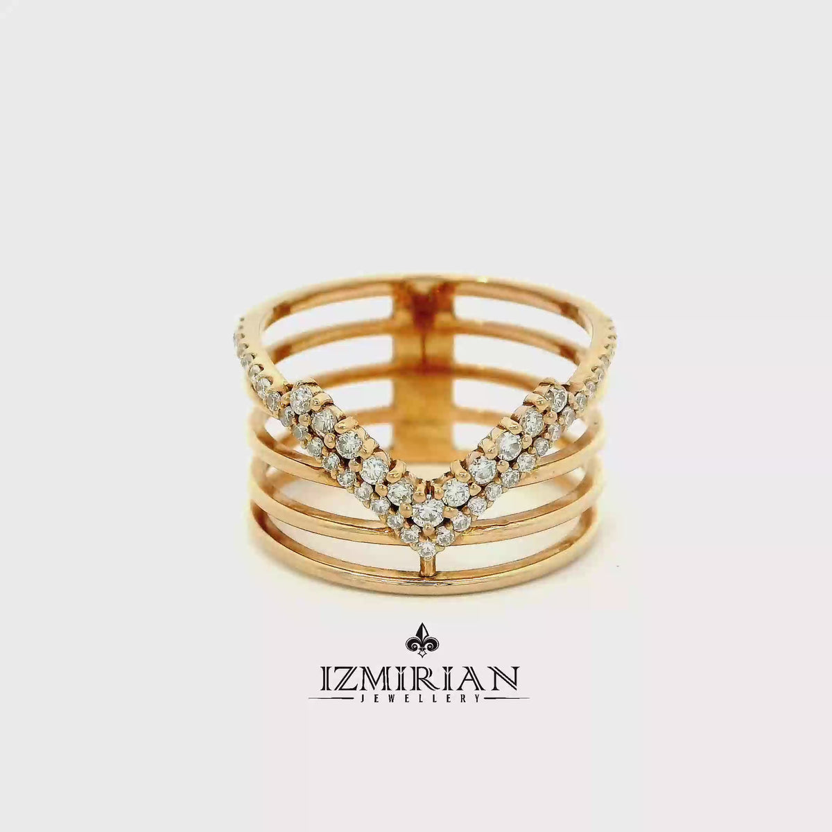 Diamond chevron multi-band ring in yellow gold shown in motion