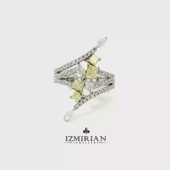 Yellow and white diamond open ring in white gold shown in motion