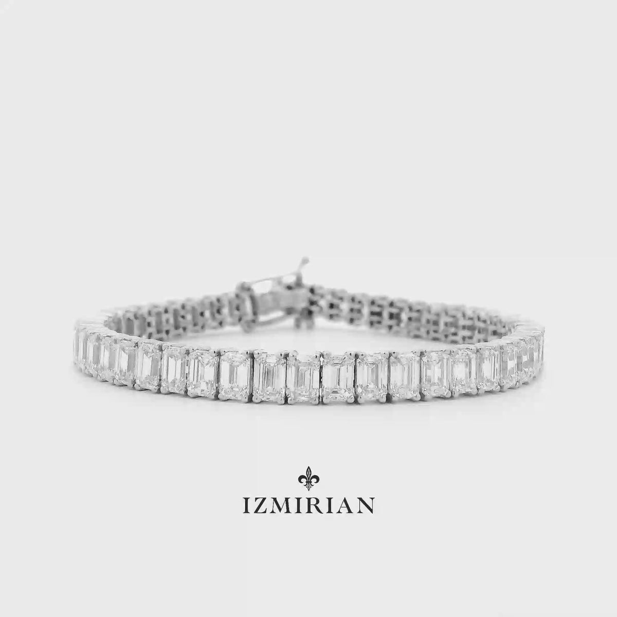 Emerald-cut diamond tennis bracelet in white gold shown in motion