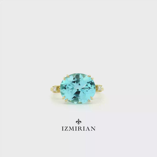 Round aquamarine solitaire ring in yellow gold shown in motion