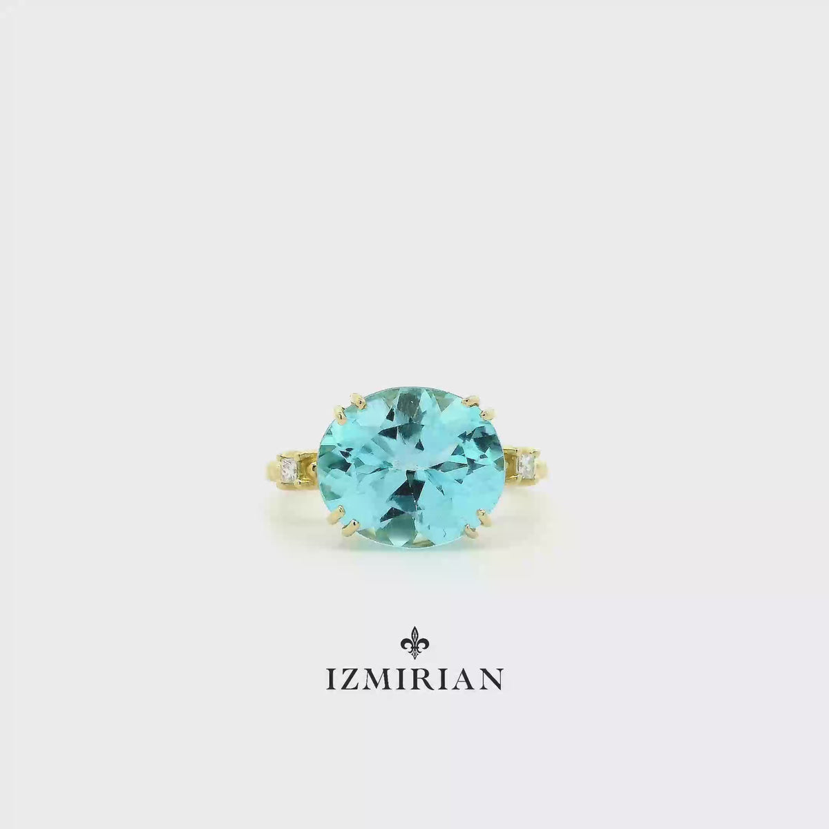 Round aquamarine solitaire ring in yellow gold shown in motion
