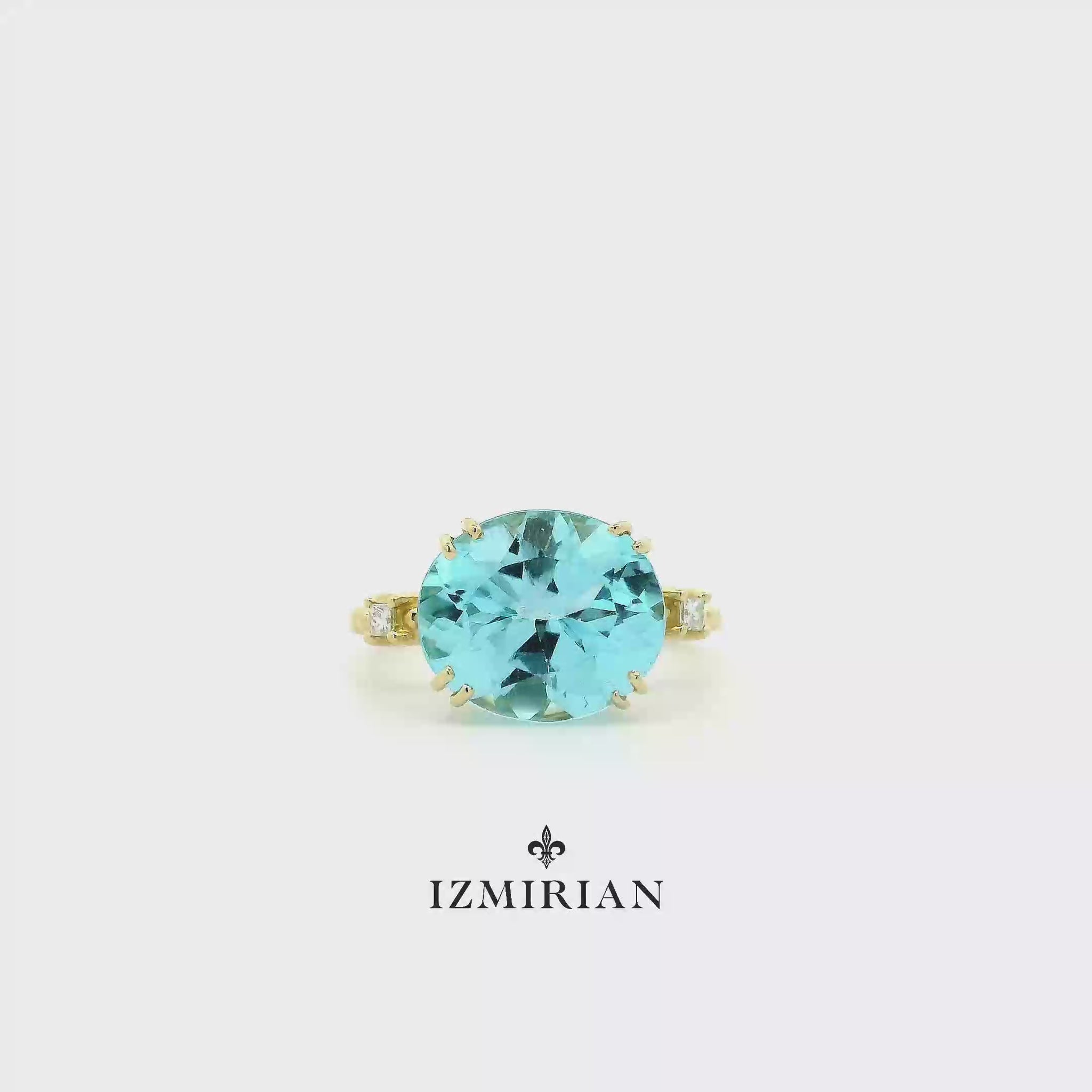 Round aquamarine solitaire ring in yellow gold shown in motion