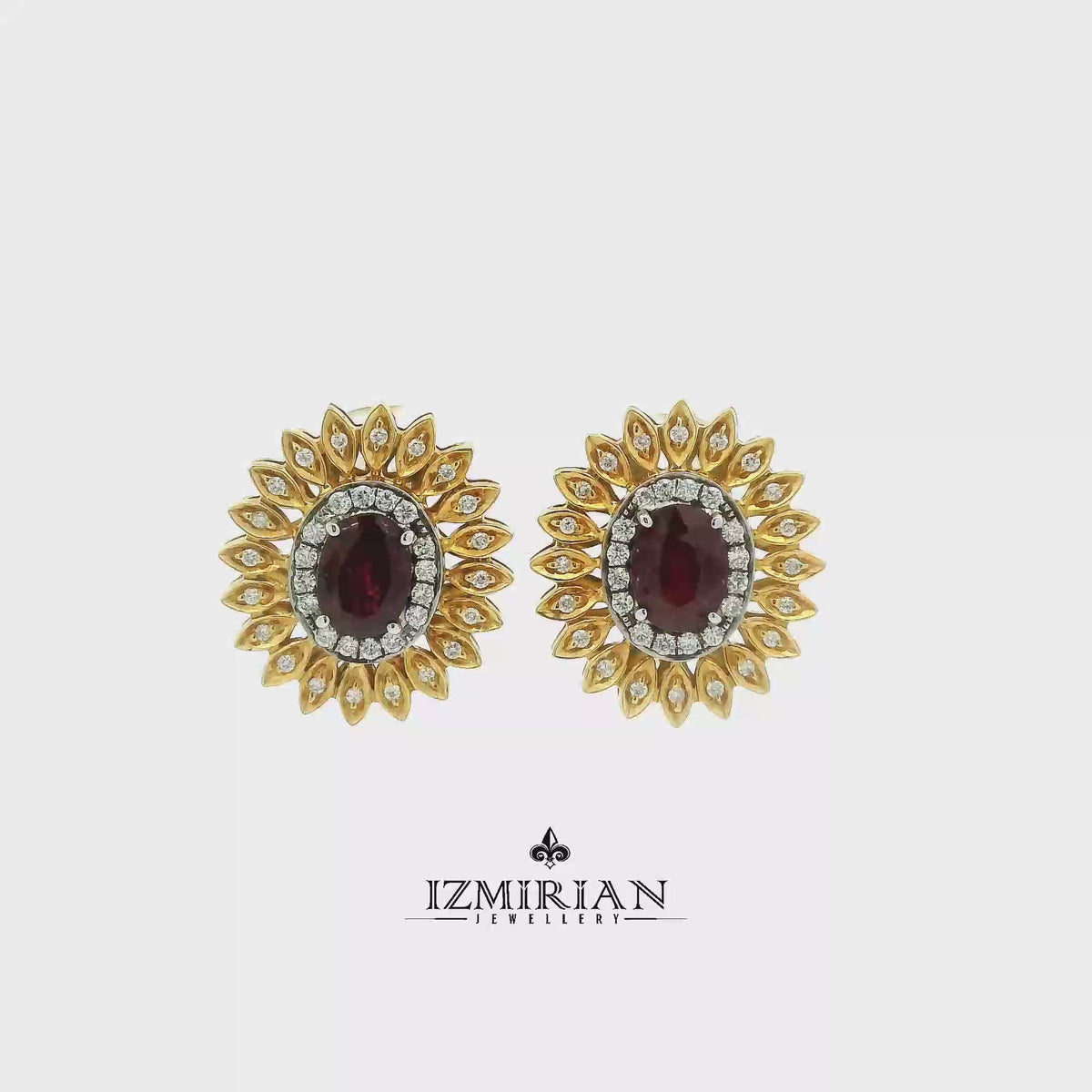 Ruby and diamond sunburst ring in yellow gold shown in motion