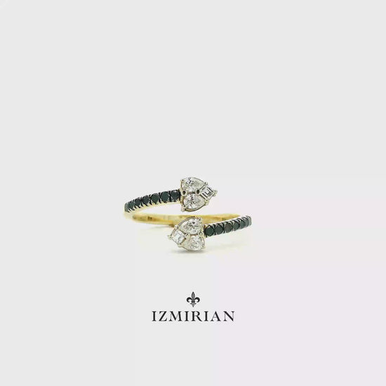 Diamond open wrap ring in yellow gold with green gemstones shown in motion